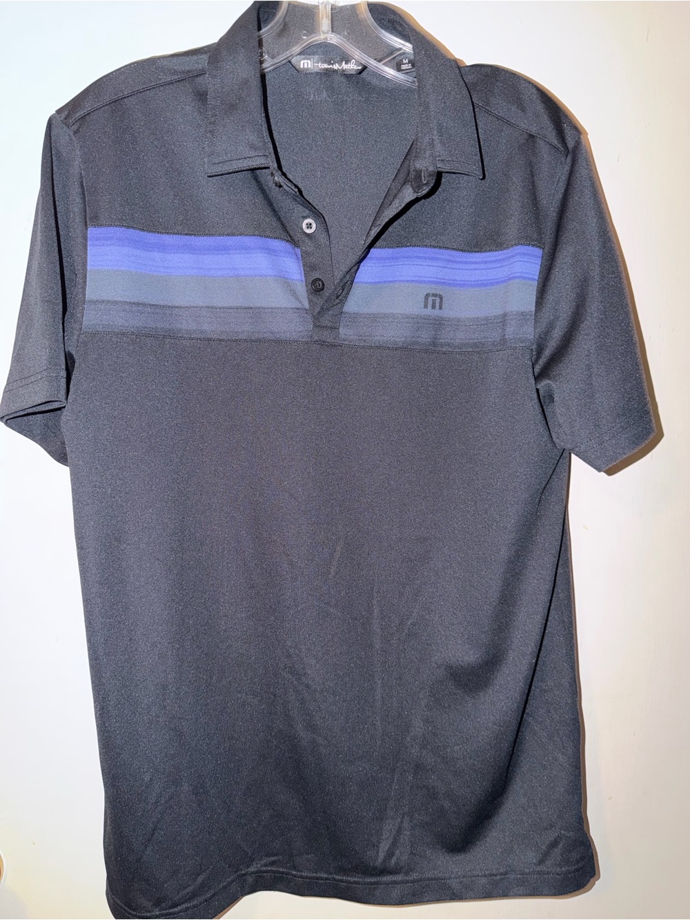 Travis Mathew Black Polo with Blue Stripe Accents